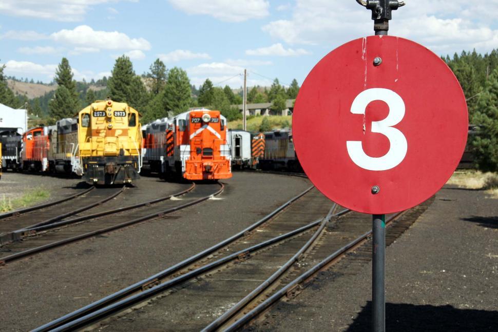 Free Image of Red Sign by Train Track 
