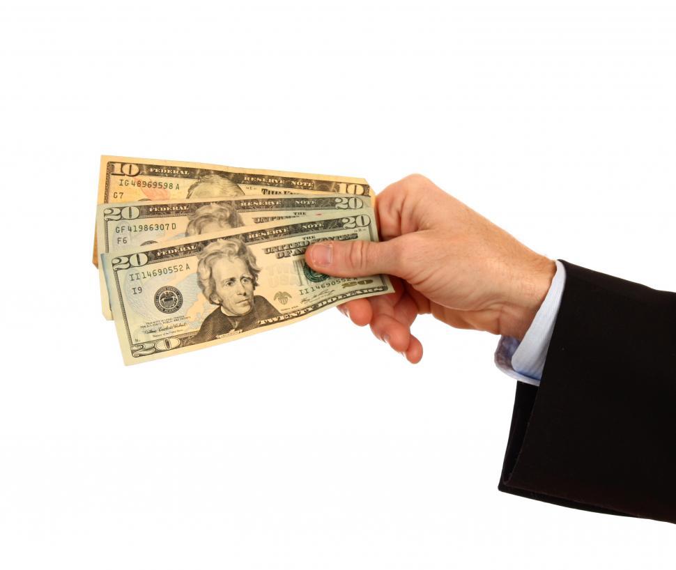 Free Image of A Hand Holding Money 
