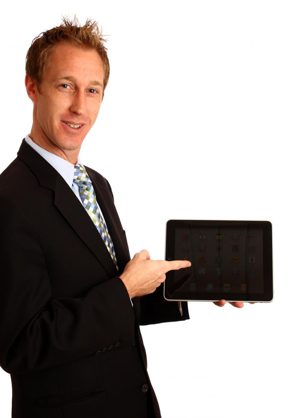 Free Image of A young businessman holding a tablet computer 