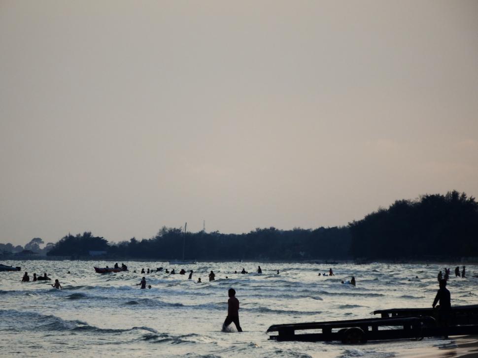 Free Image of Sunset Swimmers Silhouette 