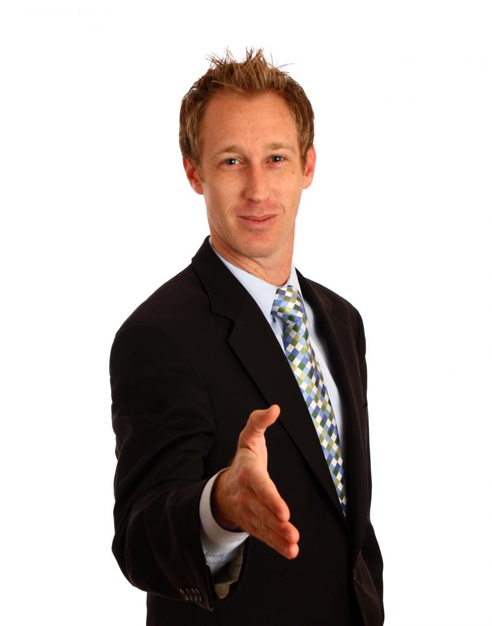 Free Image of A young businessman extending his hand for a handshake 