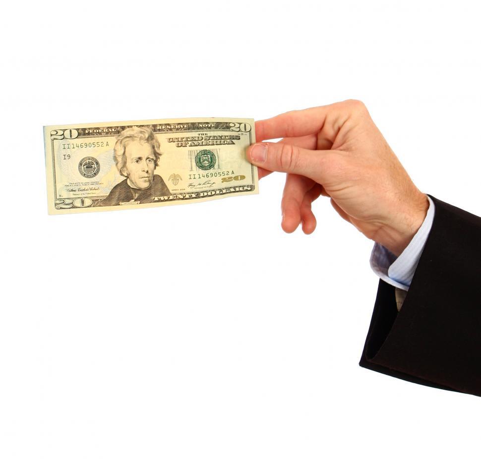 Free Image of A hand holding a twenty dollar bill 