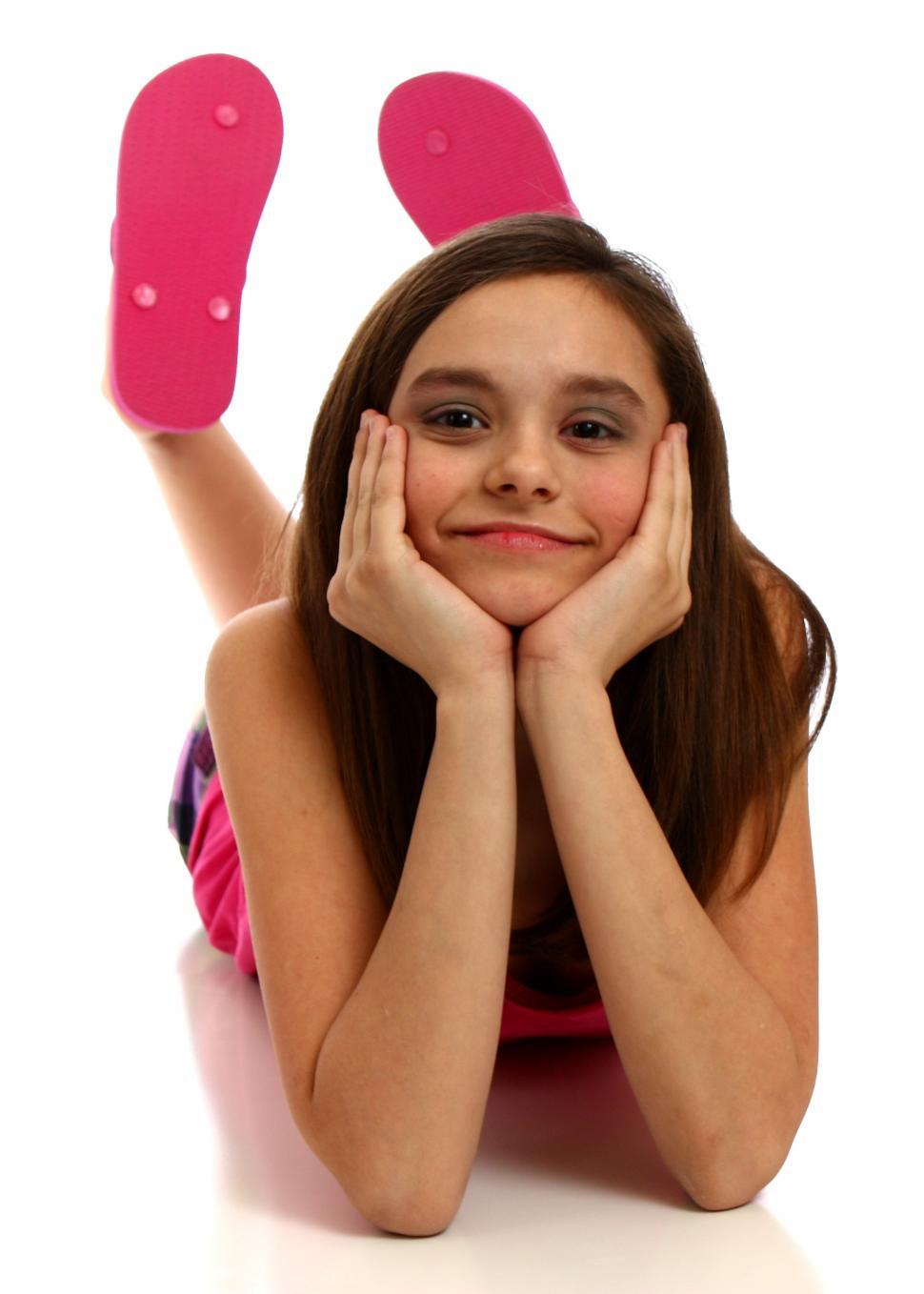 Free Image of A cute young girl posing on a white background 