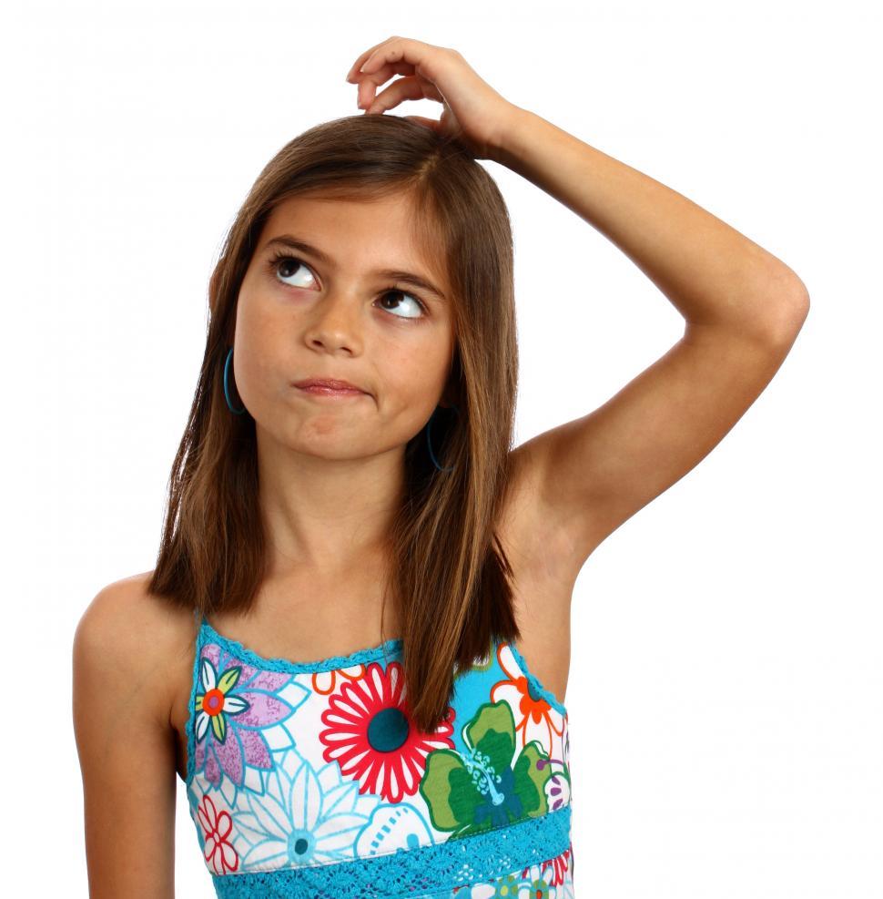 Free Image of A pretty young girl with a thoughtful expression 