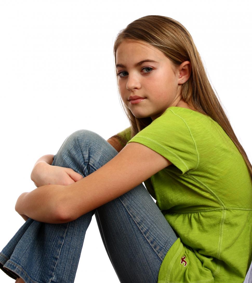 Free Image of A beautiful young girl posing with a white background 