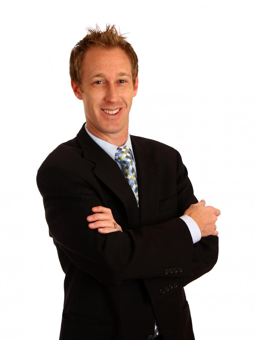 Free Image of A young businessman with crossed arms isolated on a white background 