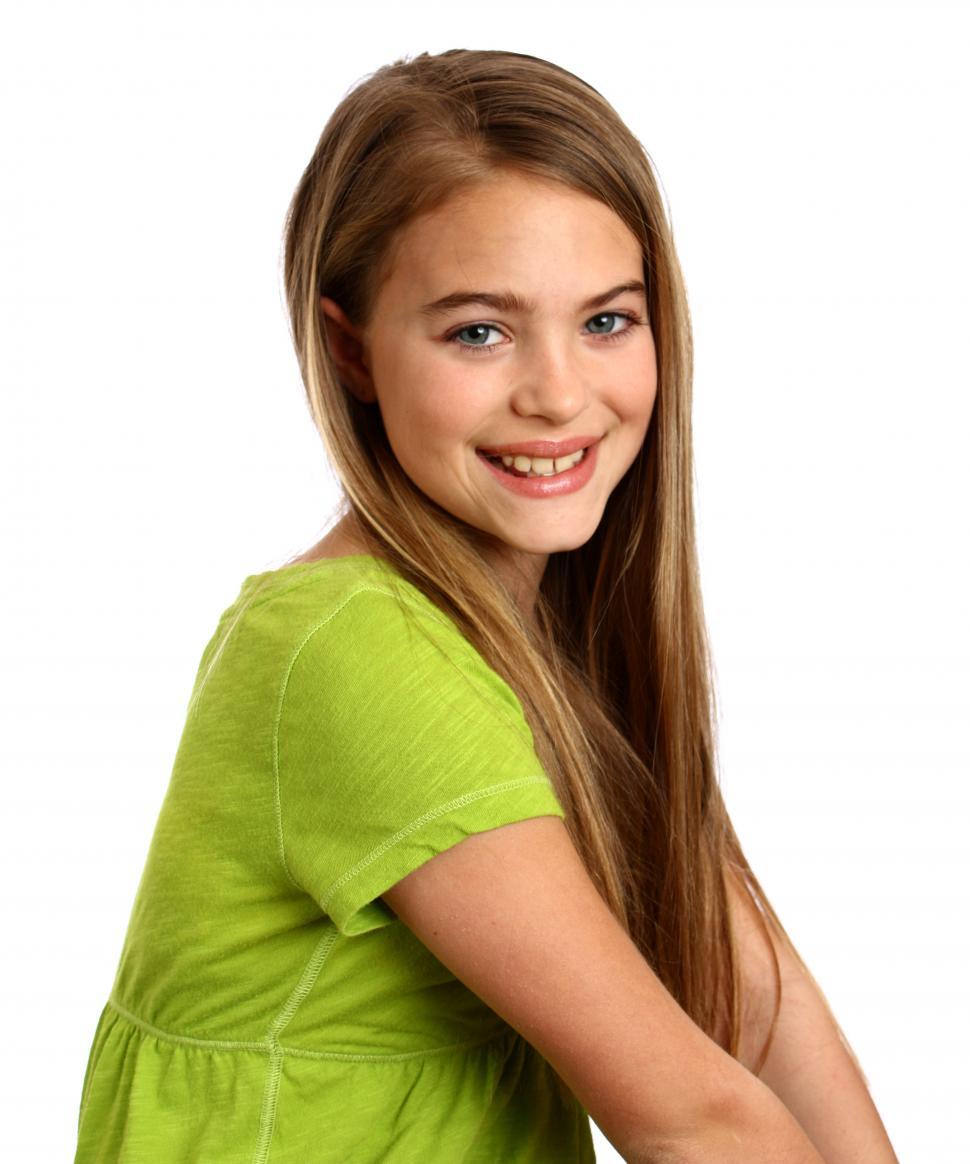 Free Image of A beautiful young girl posing with a white background 