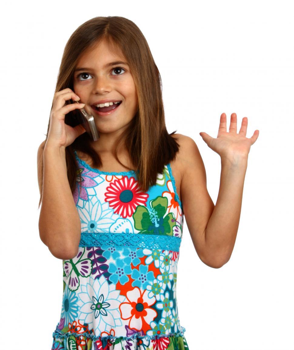 Free Image of A pretty young girl talking on a cell phone 