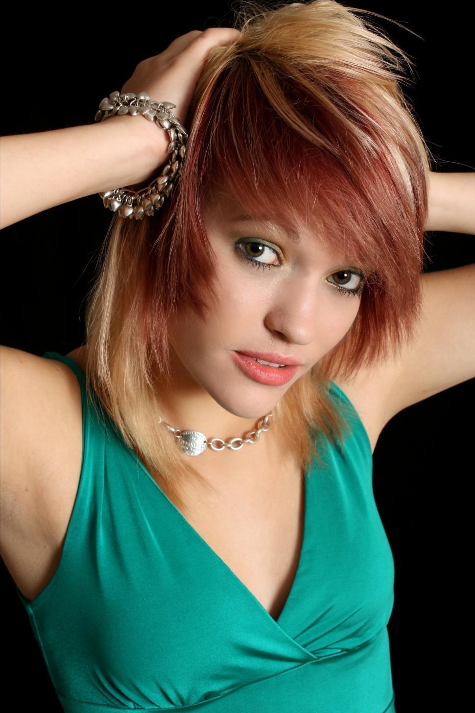 Free Image of A beautiful young woman in a dress isolated on a black background 