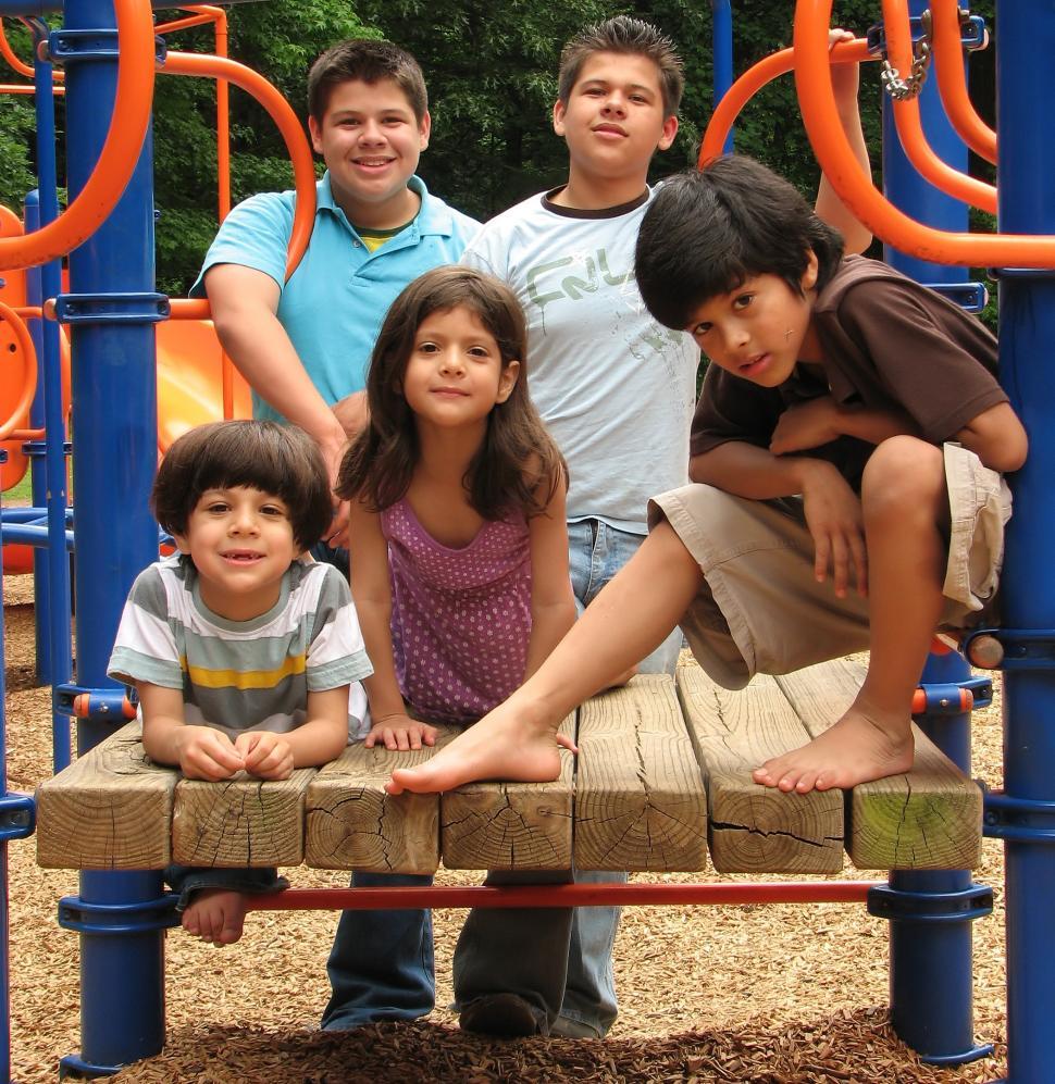 Free Image of A group of latino kids posing on a playground 