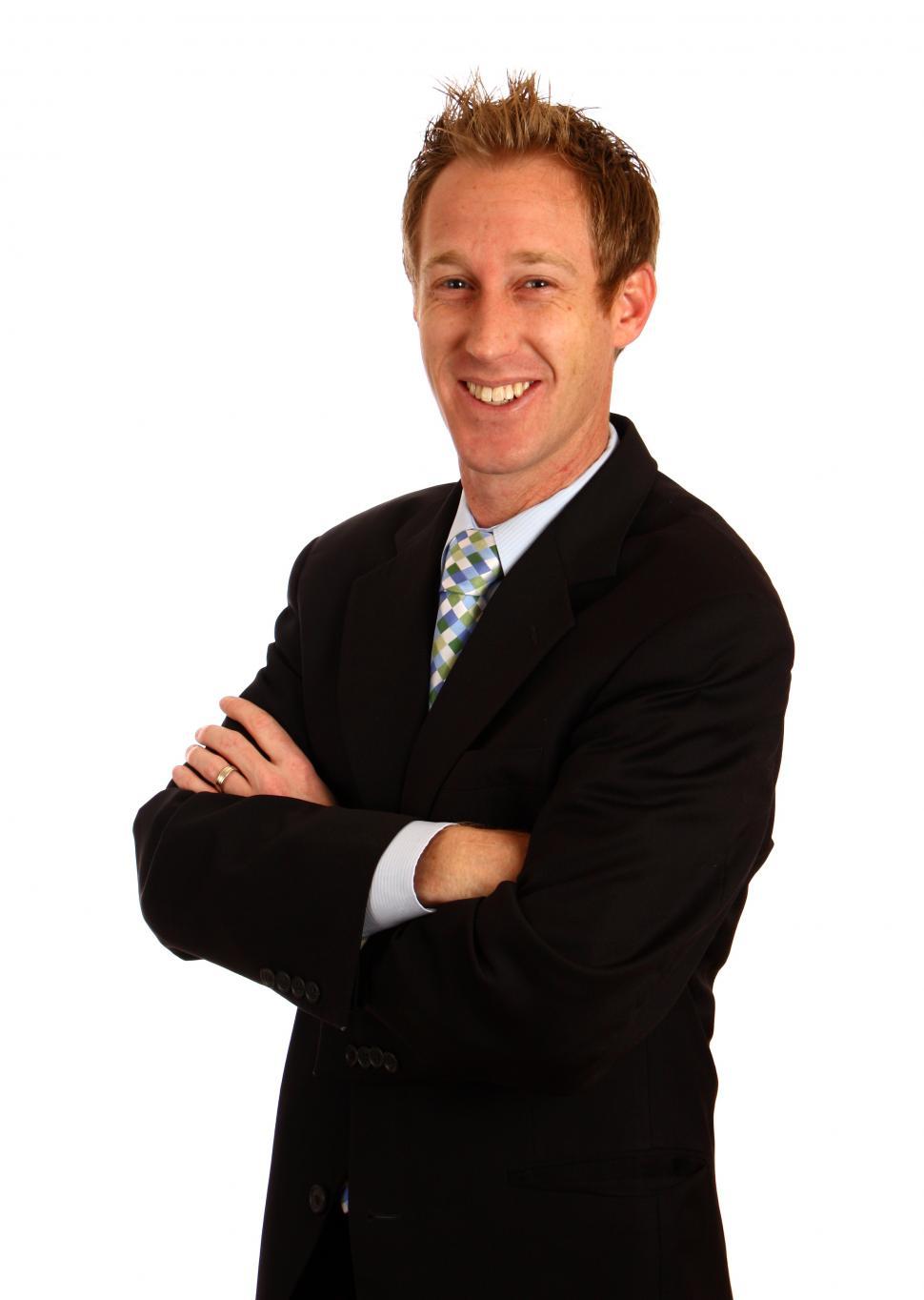 Free Image of A young businessman with crossed arms isolated on a white background 
