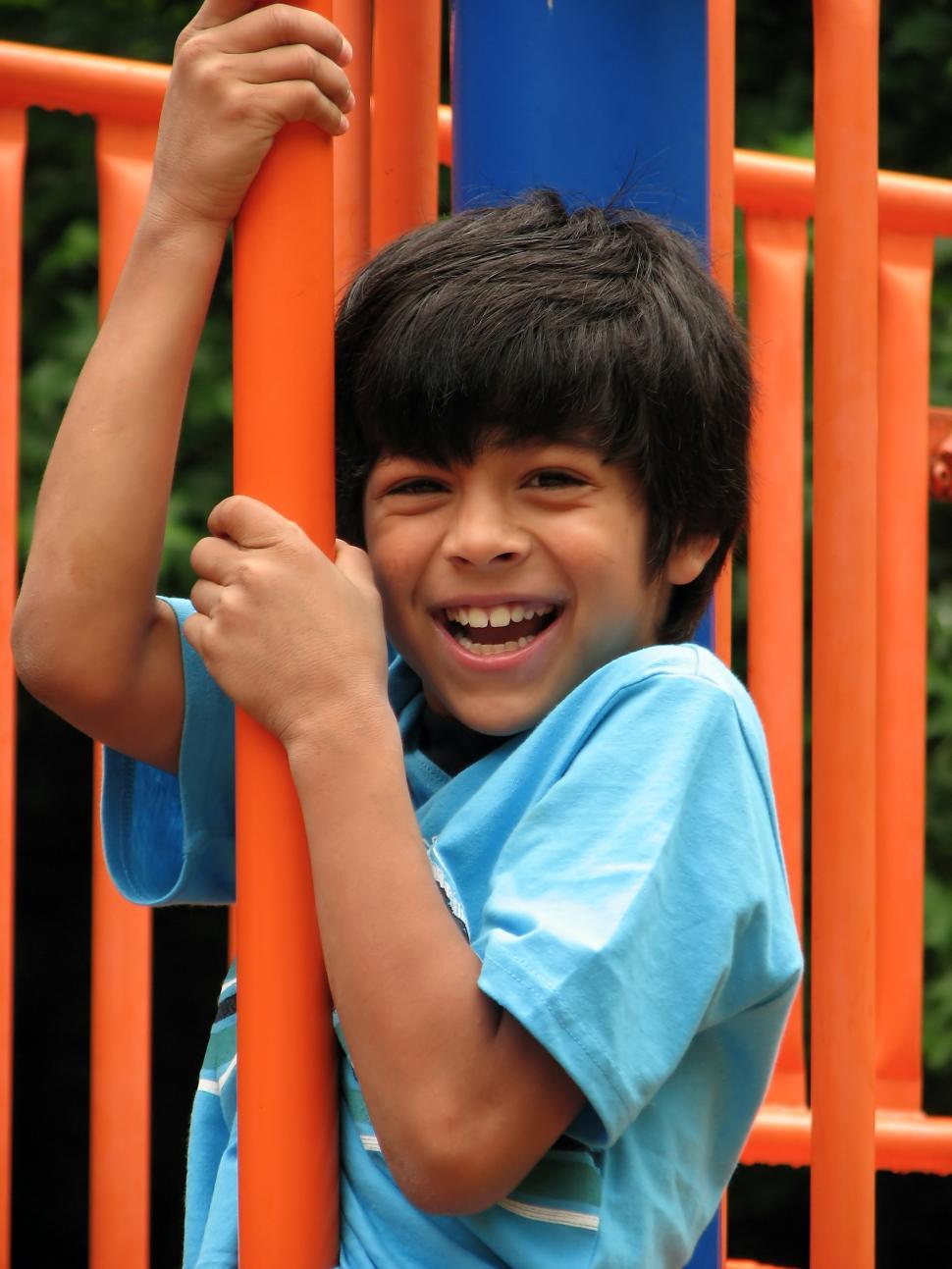 Free Image of A young latino boy playing on a playground 