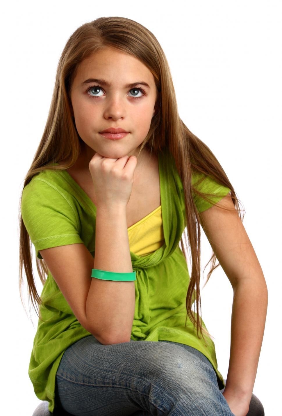 Free Image of A beautiful young girl with a thoughtful expression 