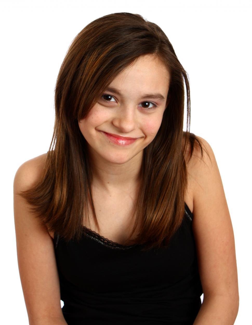 Free Image of A cute young girl posing on white background 