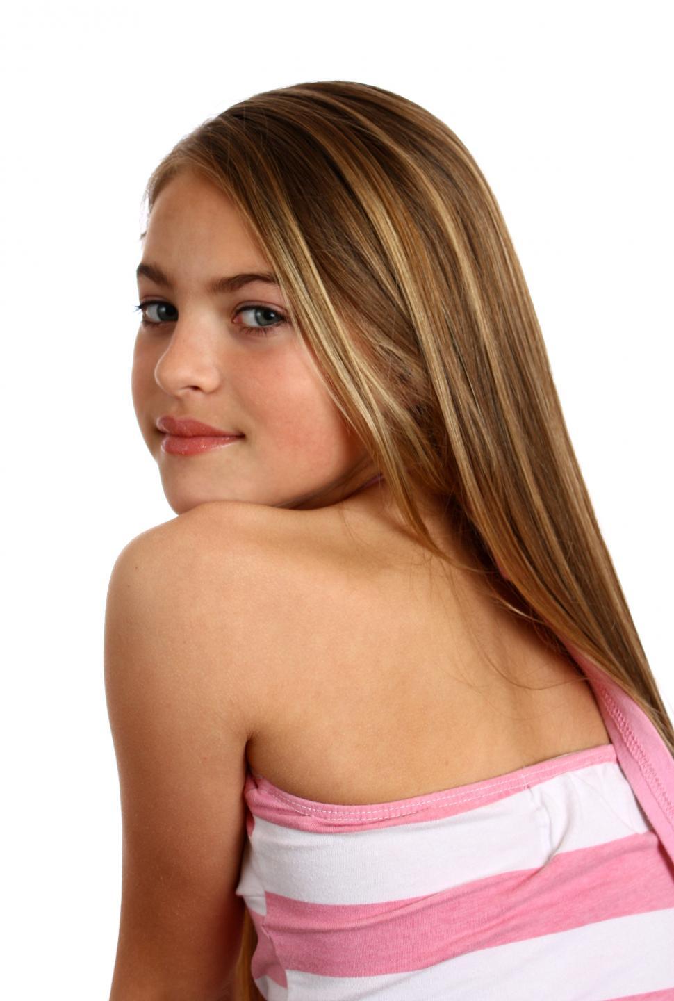 Free Image of A beautiful young girl posing on a white background 