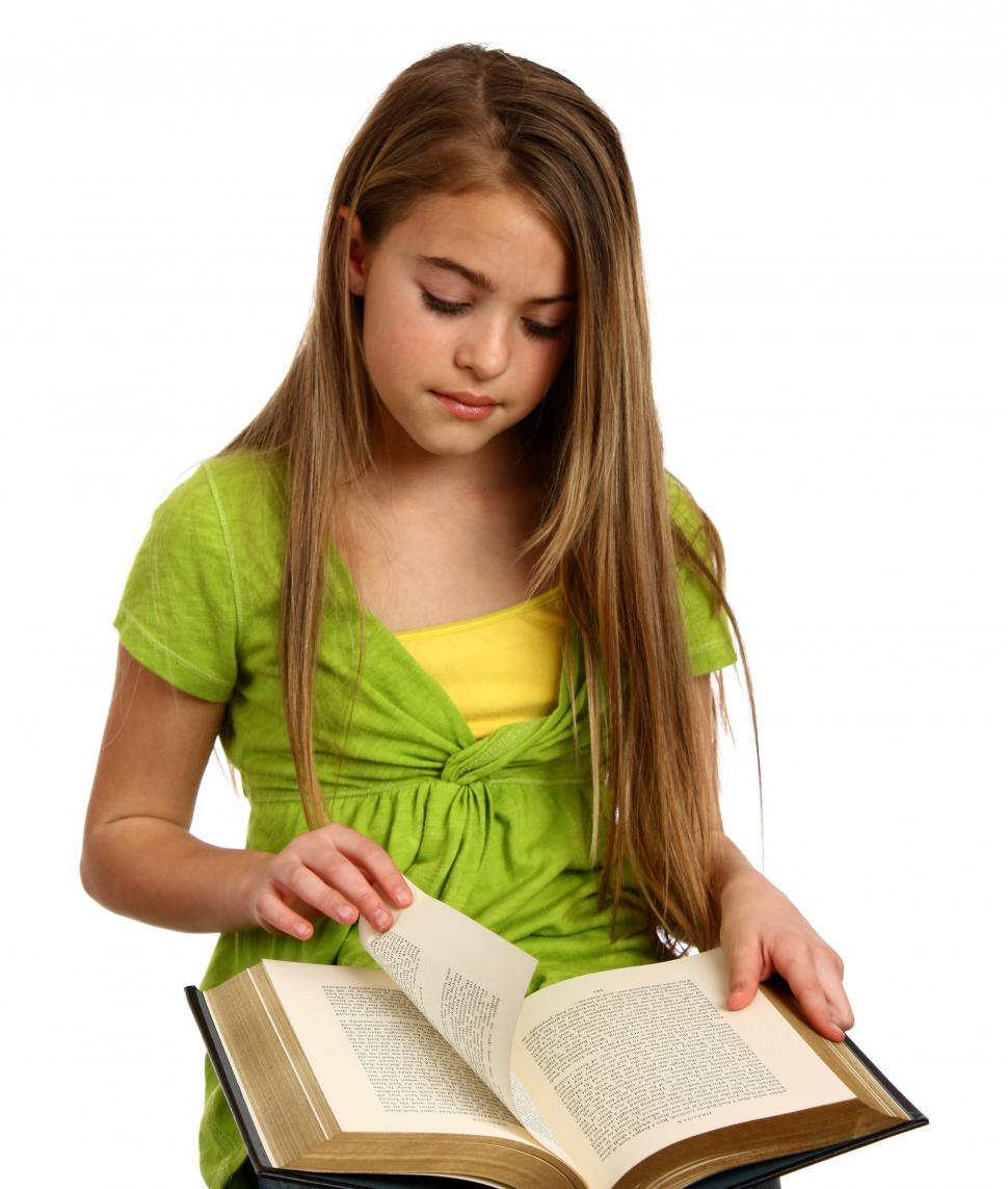 Free Image of A beautiful young girl reading a book 