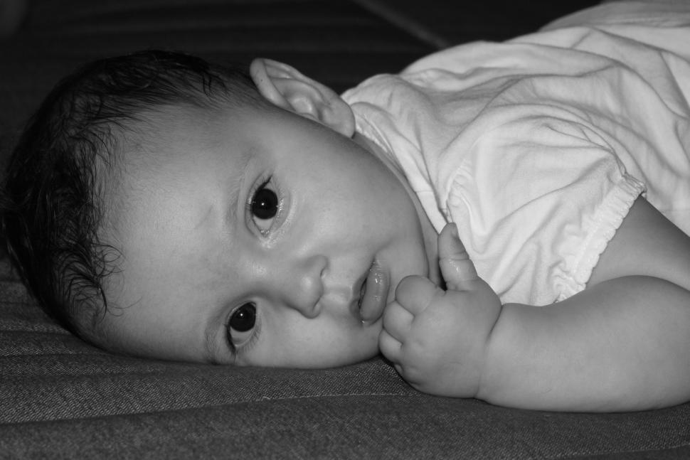 Free Image of Baby Laying on a Mattress 