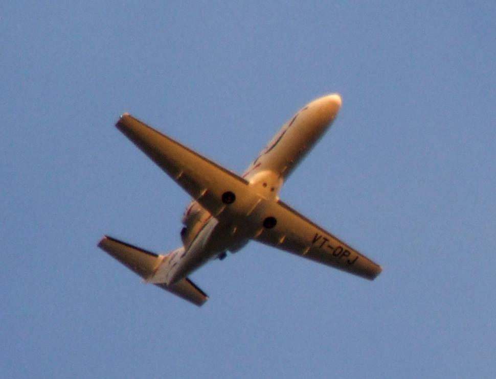 Free Image of Airplane Flying in Blue Sky 