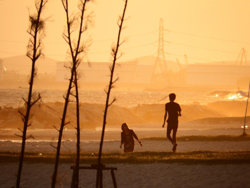 Free Image of People On the Beach at Sunset 