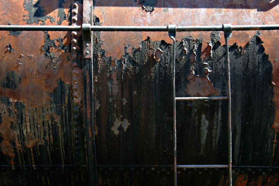 Free Image of Rusted Metal Gate With Stop Sign 