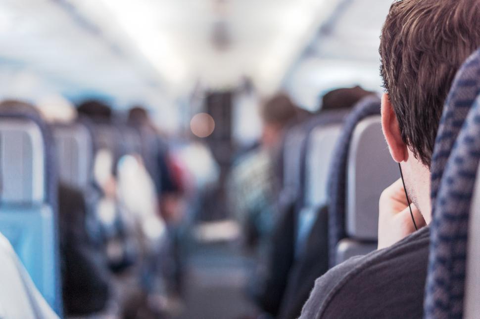 Free Image of Listening to music on the plane 