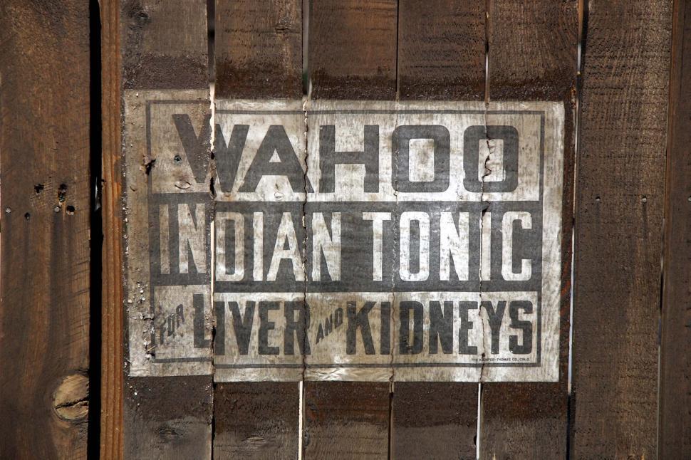 Free Image of Sign on the Side of a Wooden Fence 