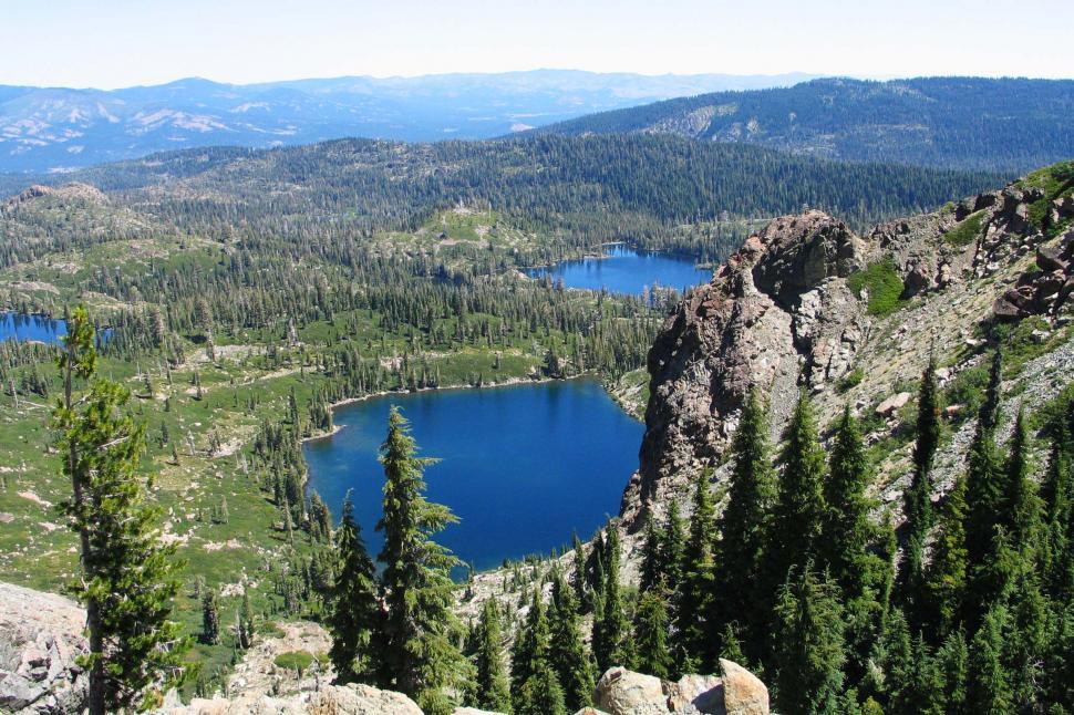 Free Image of Mountain Lake Surrounded by Trees 