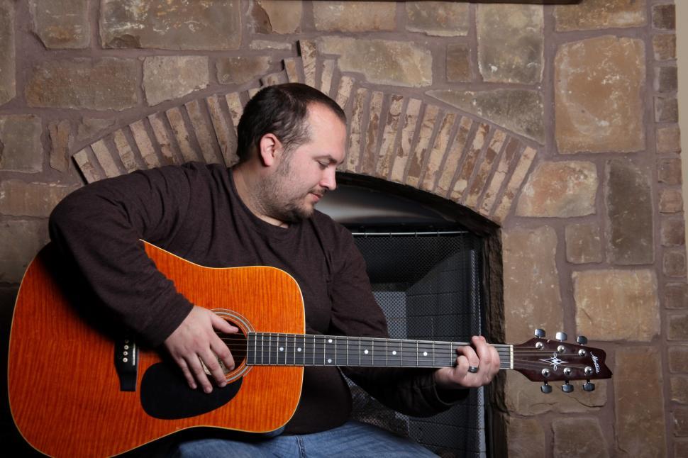 Free Image of Man playing guitar 