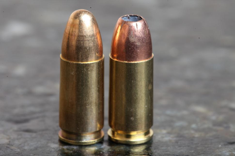 Free Image of Two 9mm bullets one hollowpoint 