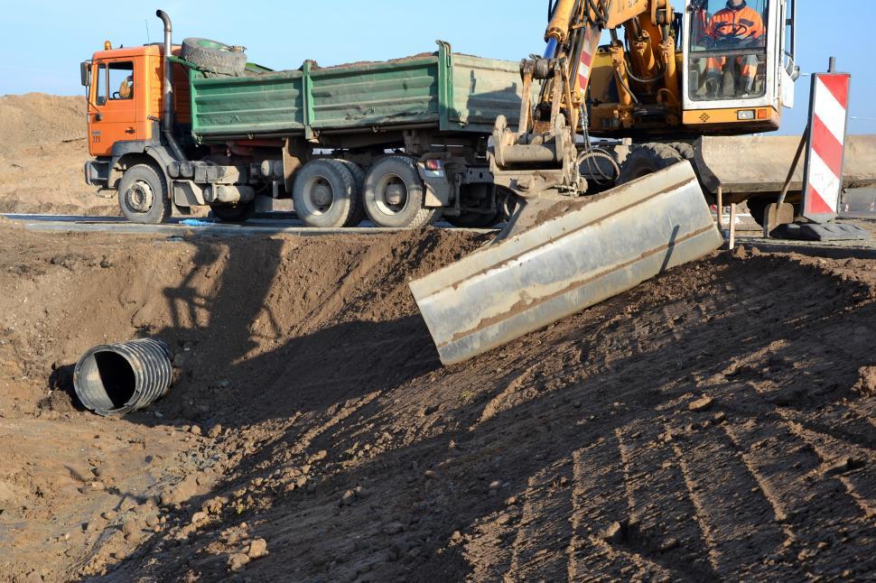 Free Image of Truck and excavator working on road 