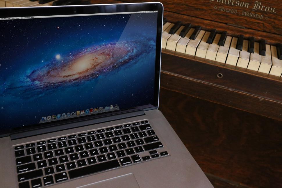 Free Image of Macbook and Piano keyboards 