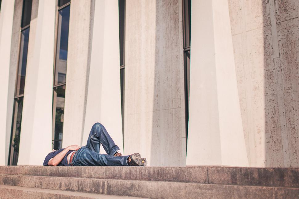 Free Image of Young Man lying on his back 