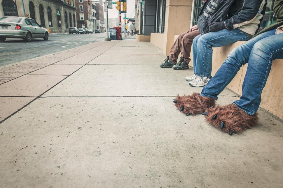 Free Image of Man in fake ape-man feets 