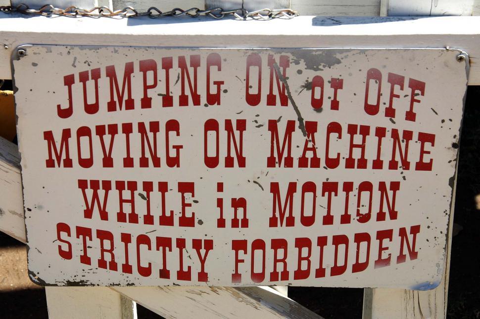 Free Image of White Sign With Red Writing 