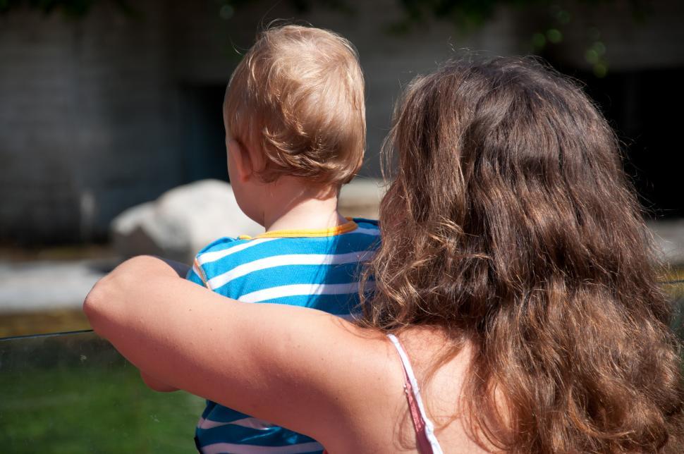 Free Image of Woman Holding Baby in Her Arms 