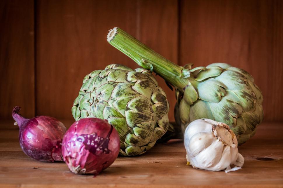 Free Image of fresh artichokes on rustic wooden background 