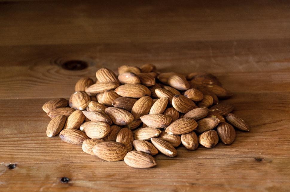 Free Image of Almonds nuts on rustic wood 
