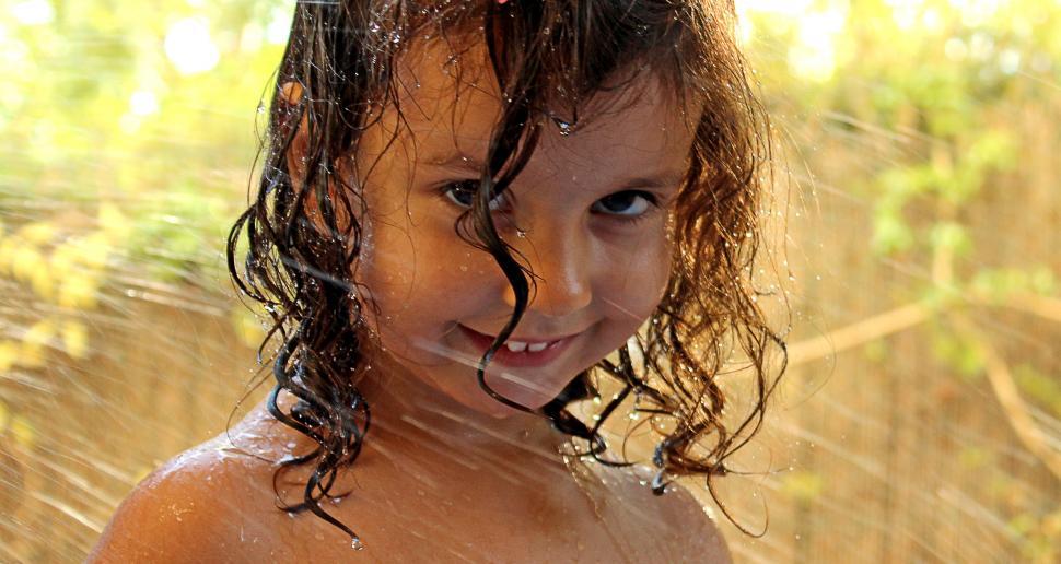 Free Image of Girl showering her head 