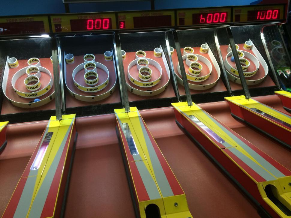Free Image of A Row of Arcade Machines 