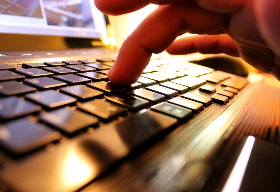 Free Image of Hands typing on laptop keyboard 