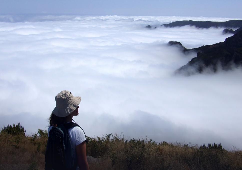 Free Image of Woman hiker gazing at stunning mountain vista 