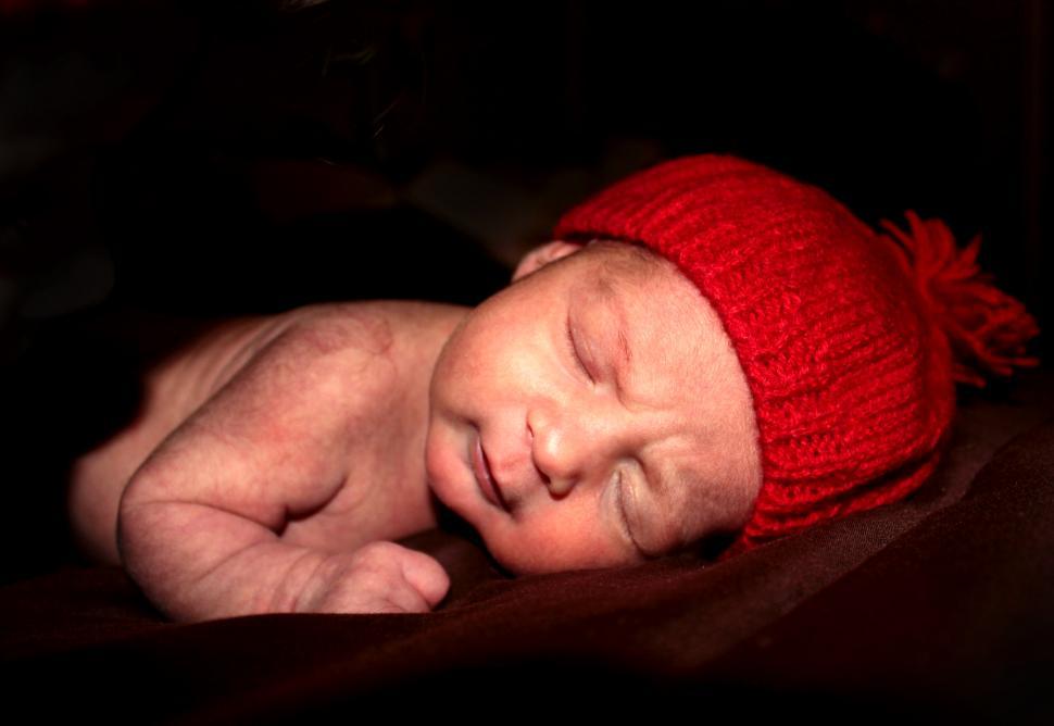 Free Image of Cute newborn baby sleeps during Christmas 