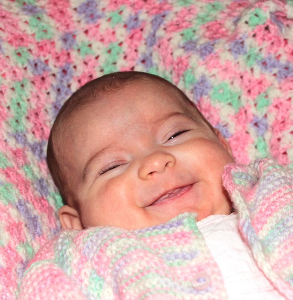 Free Image of Close-up portrait of a happy baby smiling 