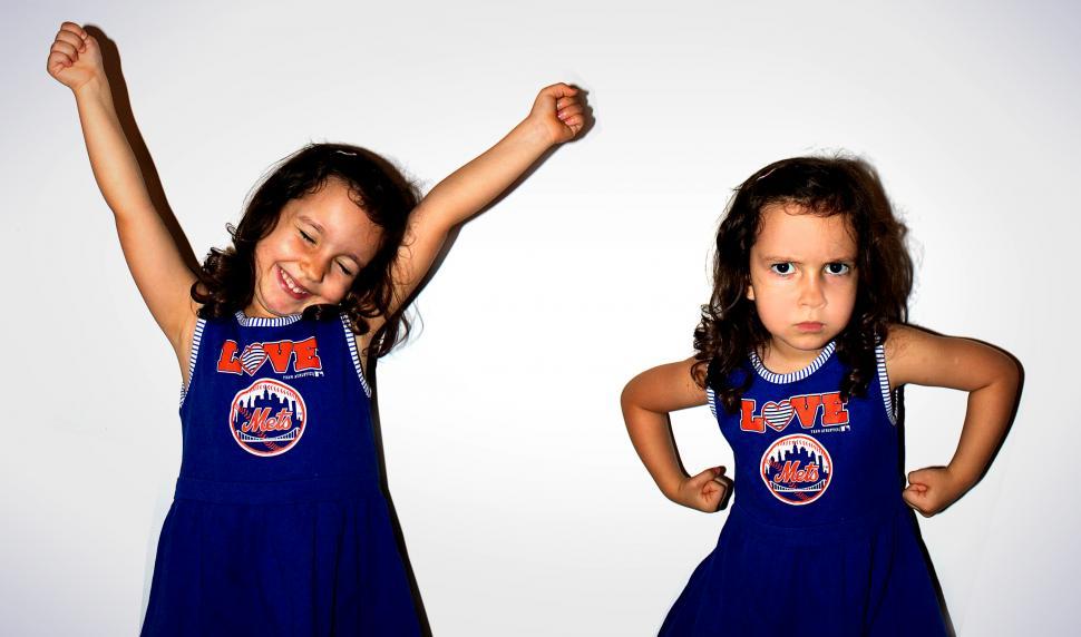 Free Image of Twin girls with opposite emotions 