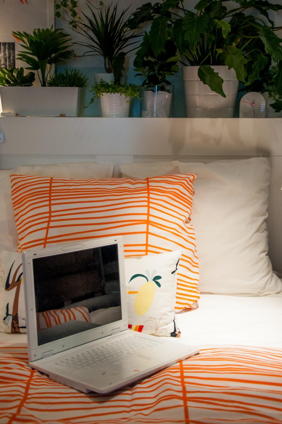 Free Image of open laptop on a bed 