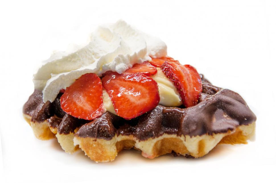 Free Image of waffle with strawberries and whipped cream 