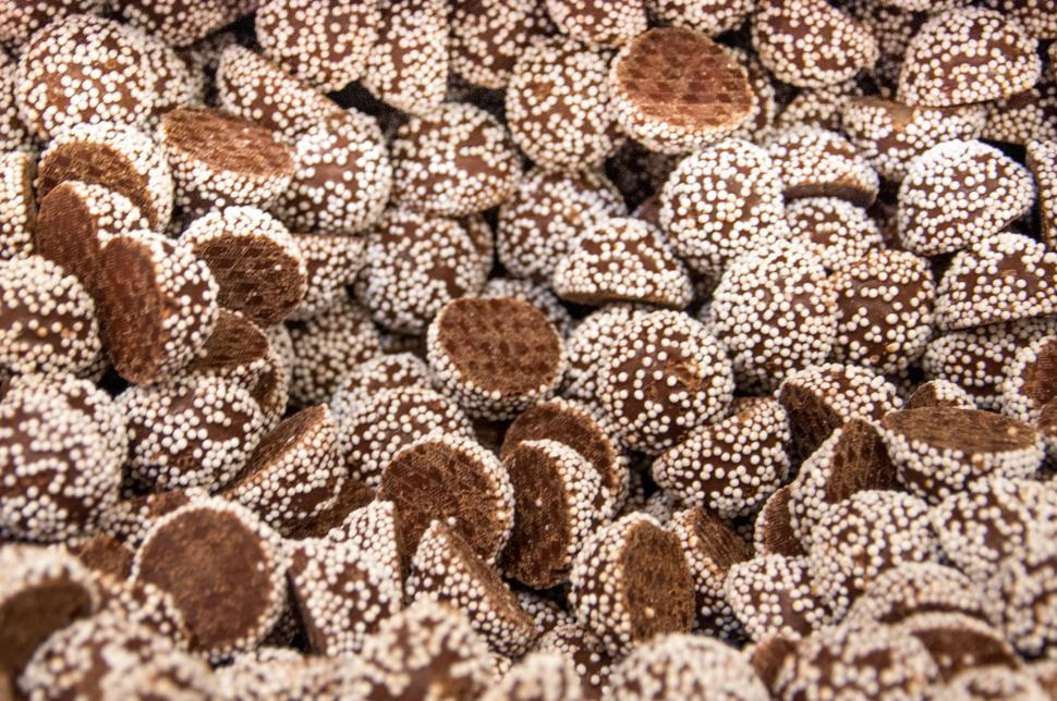 Free Image of Pile of Chocolate Covered Donuts on Table 