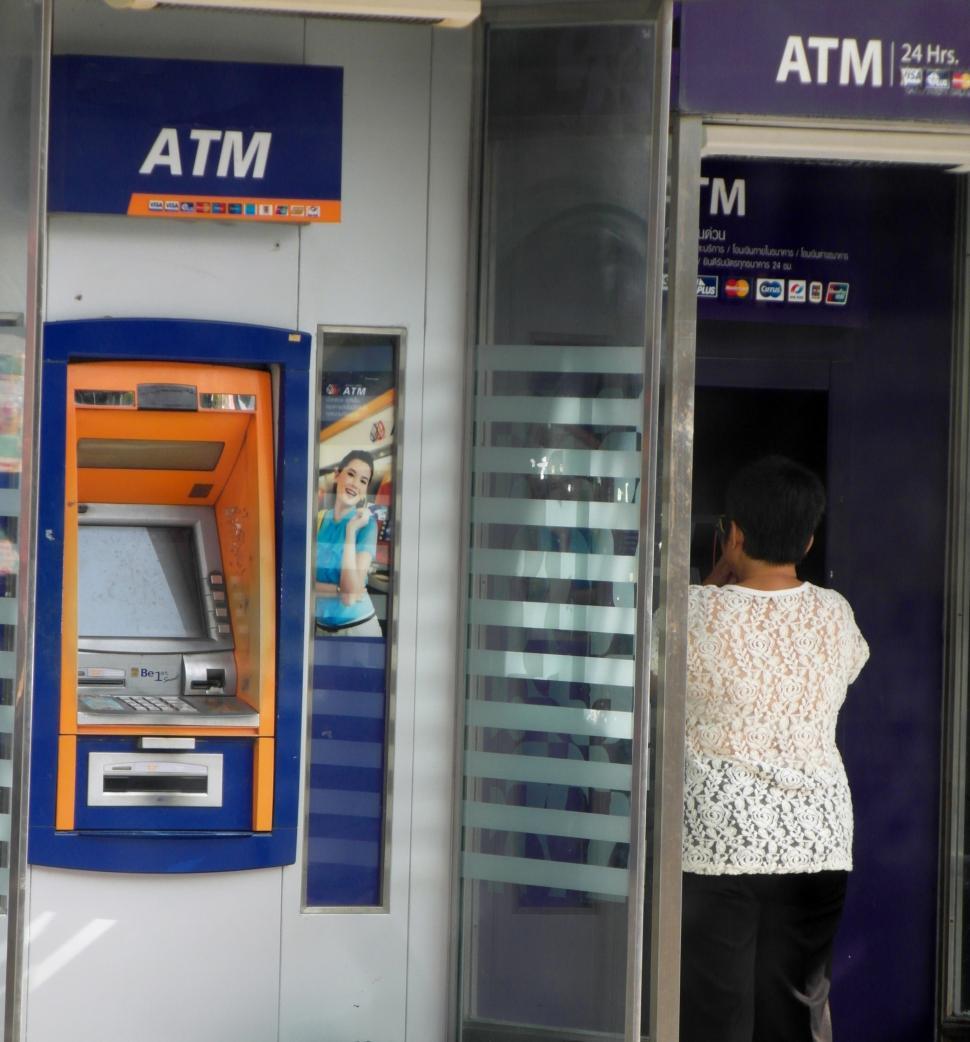 Free Image of Person Using an ATM Machine 