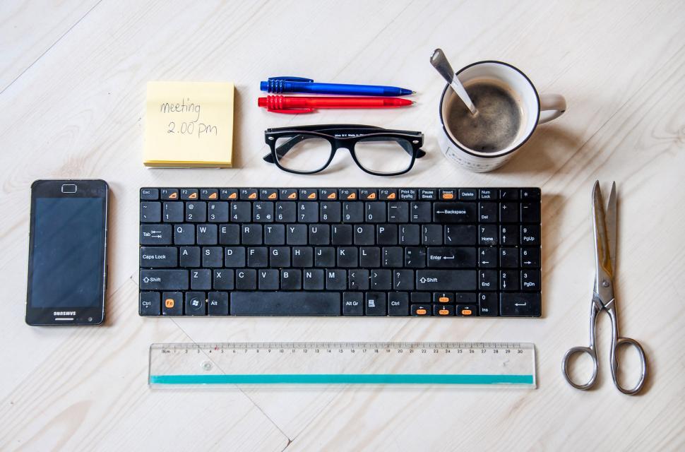 Free Image of coffee cup and office supplies 