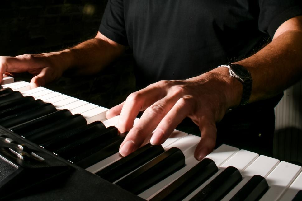 Free Image of man playing keyboard piano 